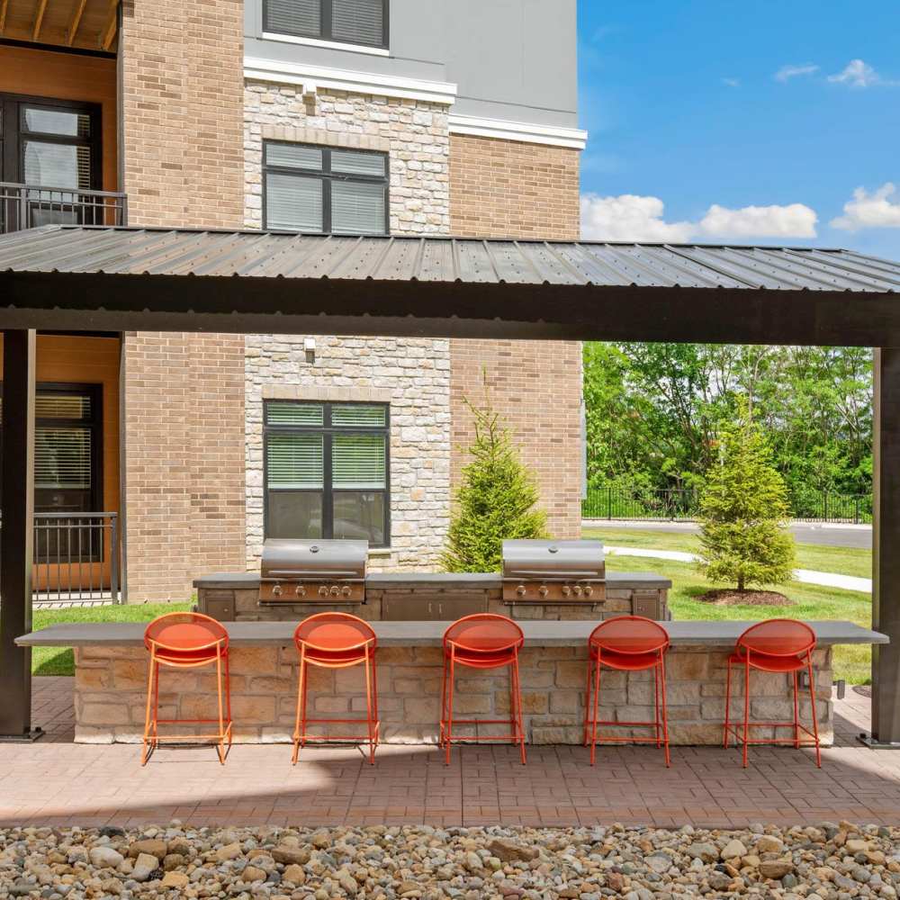 Outdoor seating with grill staion at Neo Vantage Point in Maryland Heights, Missouri