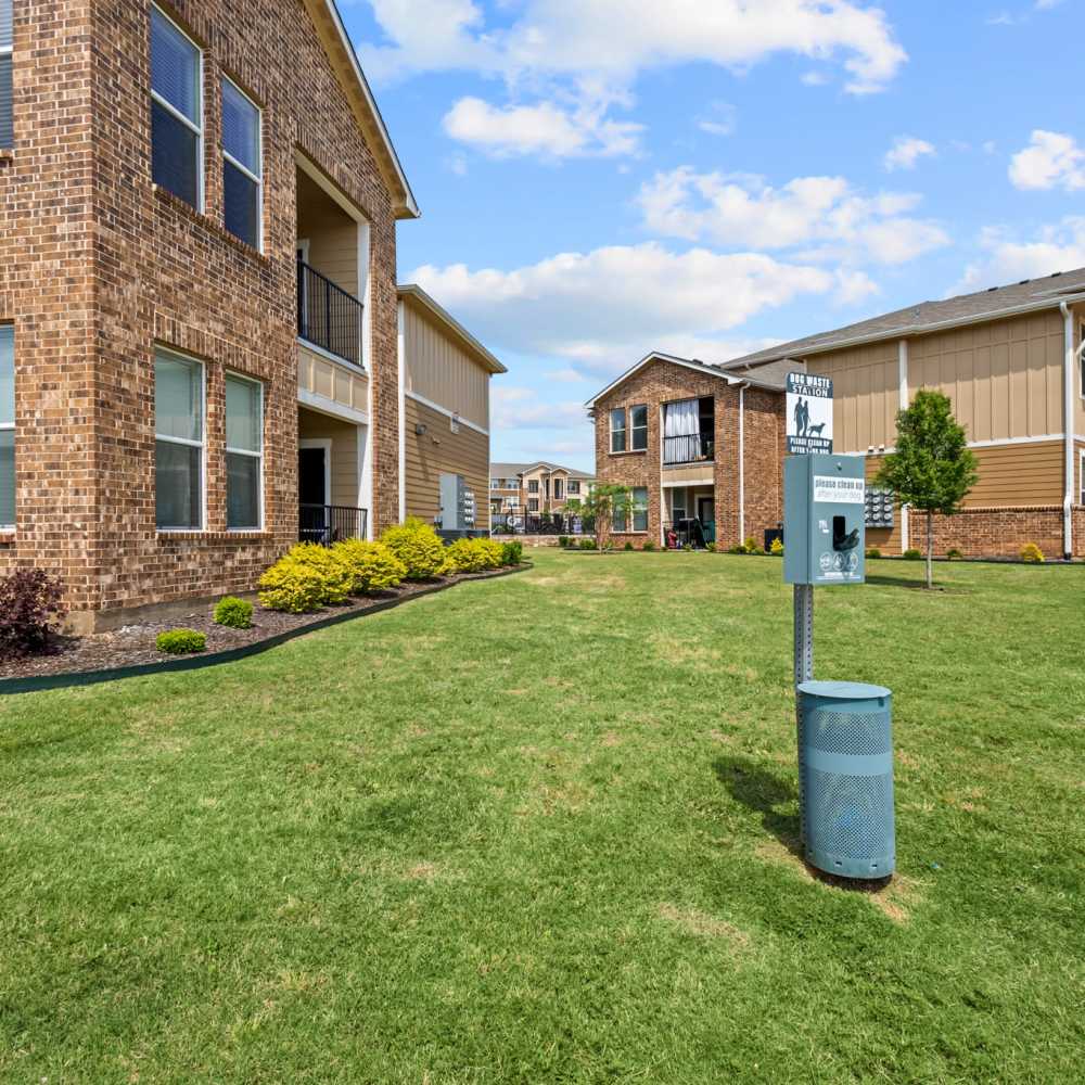 Exterior view of the community with green lawn at Deer Park in Athens, Texas