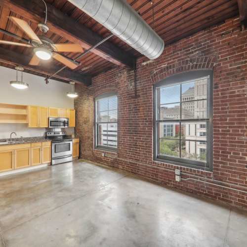 Unfurnished living room with air condition duct at Stadium Loft Apartments in Saint Louis, Missouri