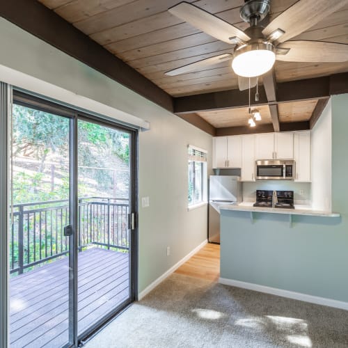 Kitchen with slider door to private patio at South Knoll in Mill Valley, California