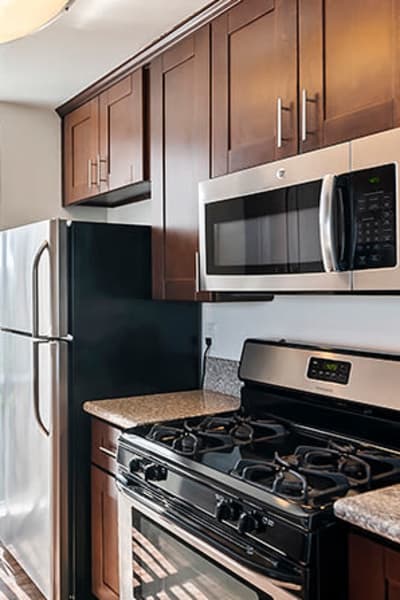 Kitchen with stainless-steel appliances at The Jessica Apartments, Los Angeles, California