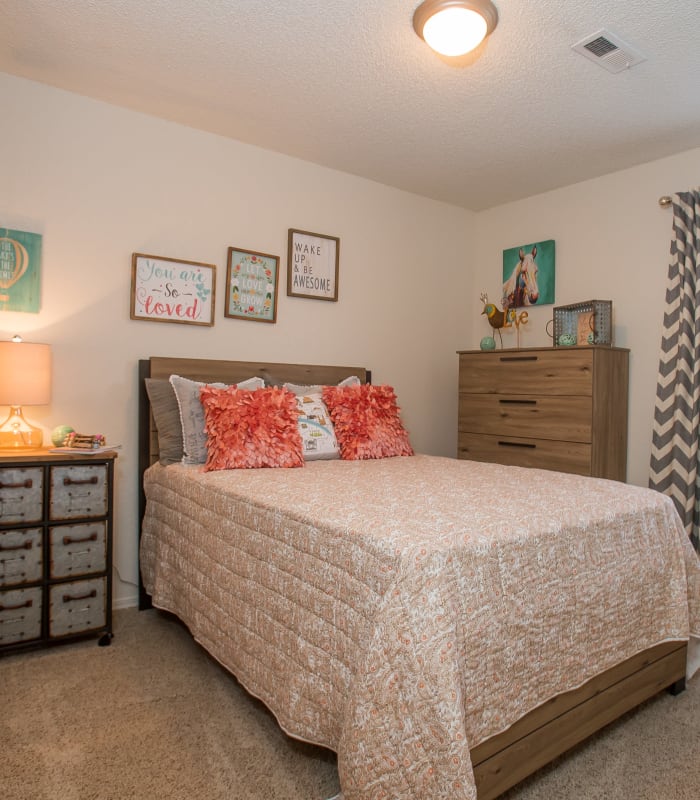 Spacious carpeted bedroom at Tammaron Village Apartments in Oklahoma City, Oklahoma