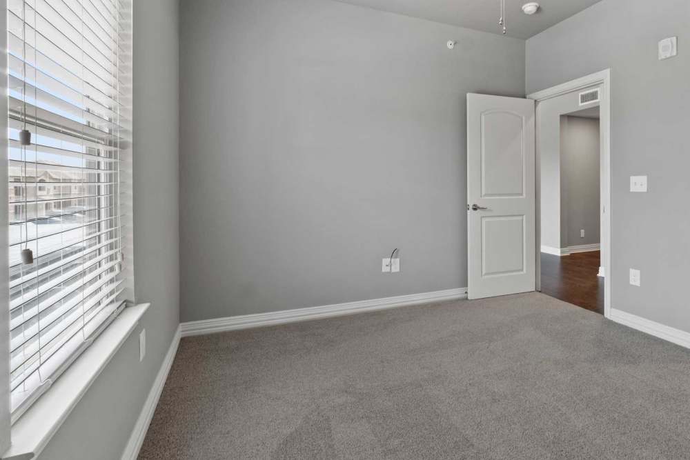 Well-lit apartment bedroom at Pine Creek in Paris, Texas