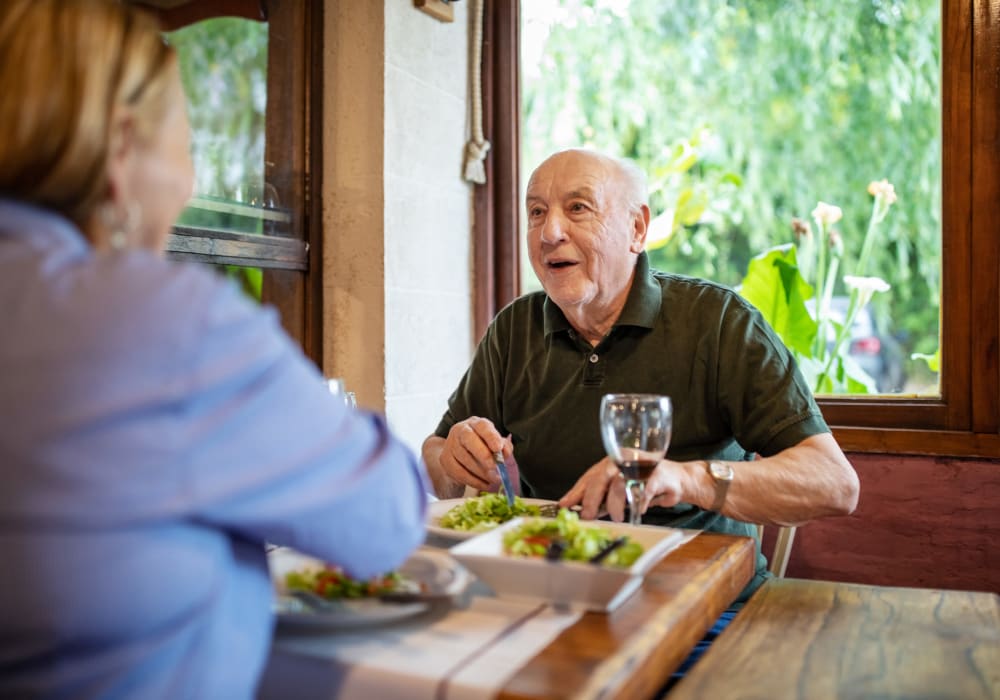 Two residents enjoying dinner at a Stoney Brook community.