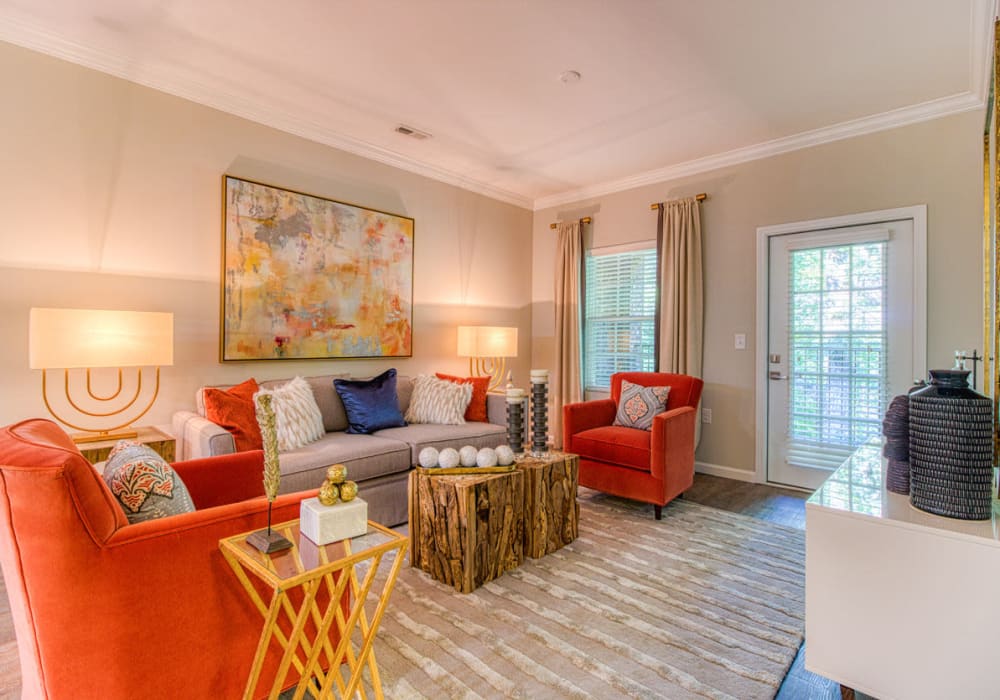 Homey and well-lit living room with plenty of room for company at Greymont Village in Asheville, North Carolina