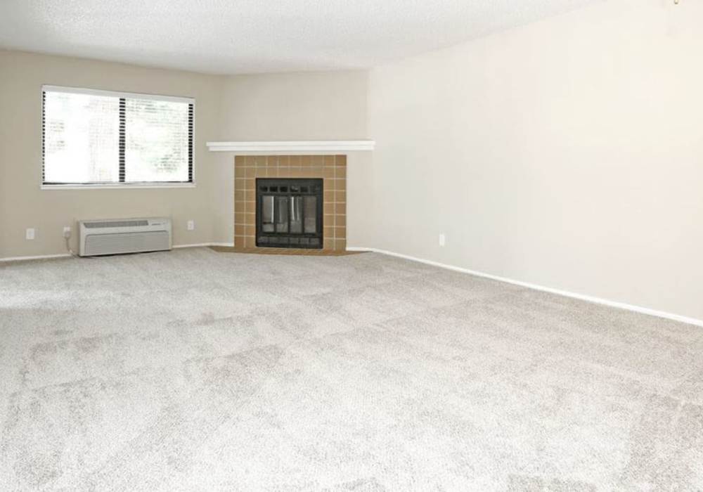 Unfurnished living room with carpet flooring and air condition at Amber Court in Fremont, California,