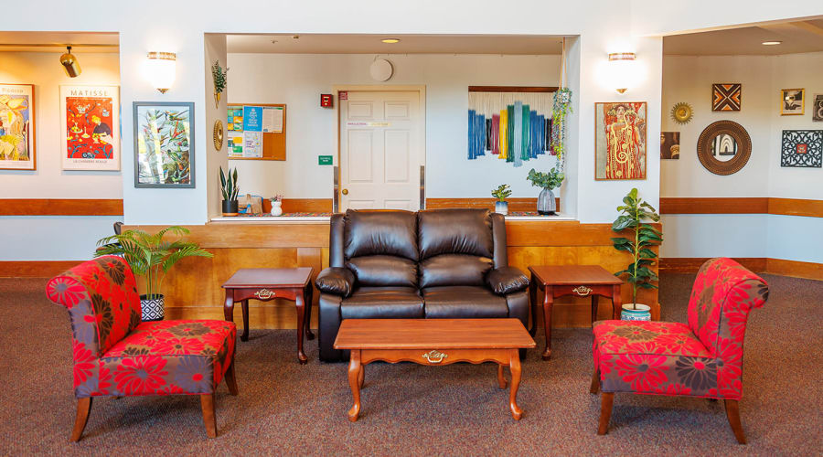 Resident relaxing in a comfortable chair at Peoples Senior Living in Tacoma, Washington