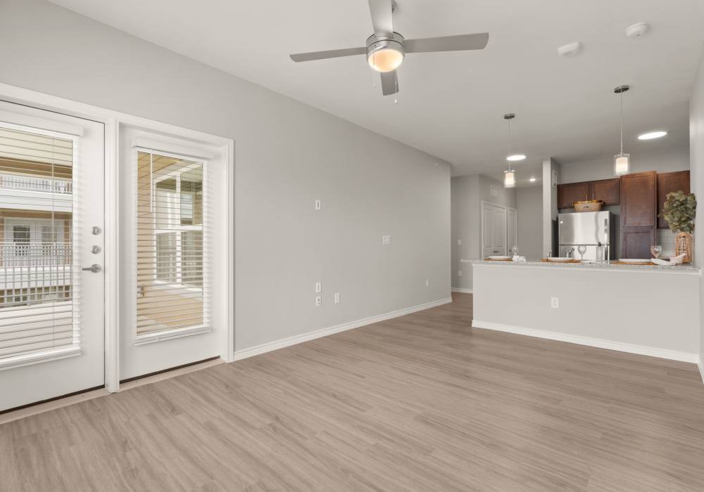 Open living room with kitchen at Walnut Springs in Seguin, Texas
