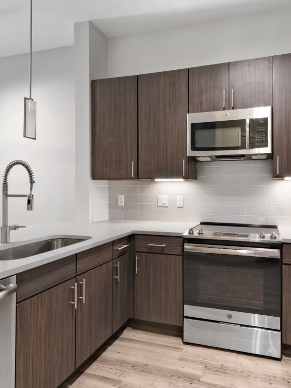 Kitchen with stainless-steel appliances at Lantower Weston Corners in Cary, North Carolina