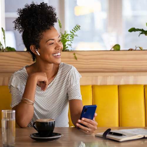 Resident enjoying her delicious coffee at a cafe near North River Landing in Elkhart, Indiana