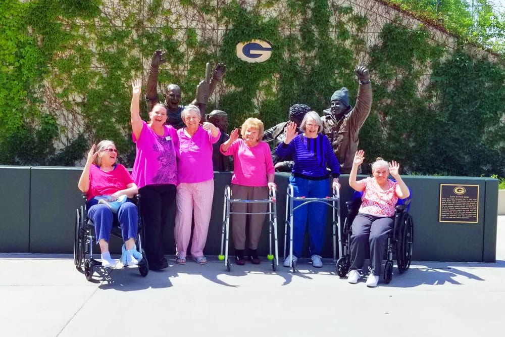 A group of cheerful residents at Wyndemere Memory Care in Green Bay, Wisconsin. 