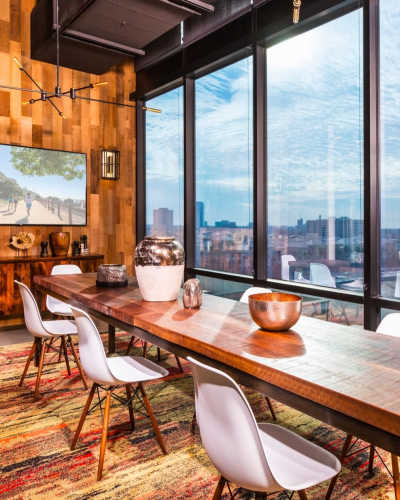 Clubhouse with table and a view at The George Apartment Homes, Anaheim, California