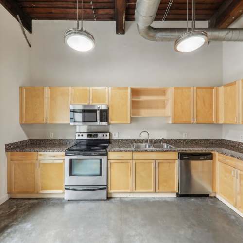 Kitchen with cabinetry at Stadium Loft Apartments in Saint Louis, Missouri