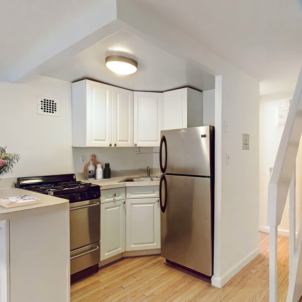 Studio apartment kitchen with cabinetry at 210-220 E. 22nd Street in New York, New York