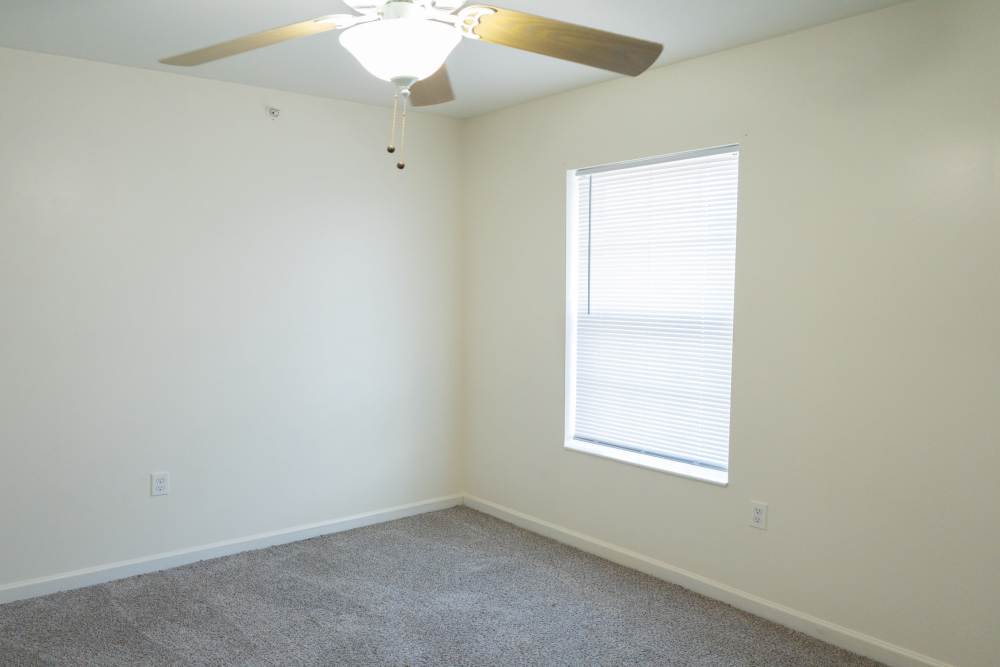 Unfurnished bedroom with a big window at Fairway Breeze in El Reno. OK