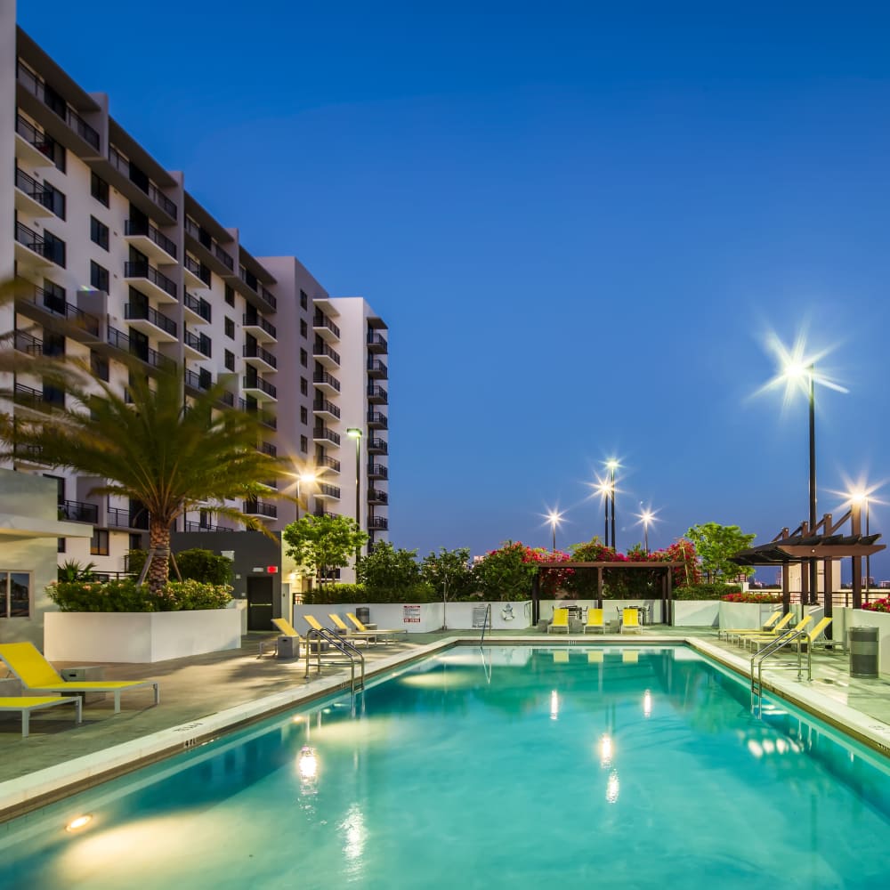 Swimming pool with lounge beds at InTown Apartments in Miami, Florida