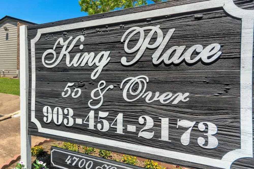 Property signage at King Place Apartments in Greenville,Texas