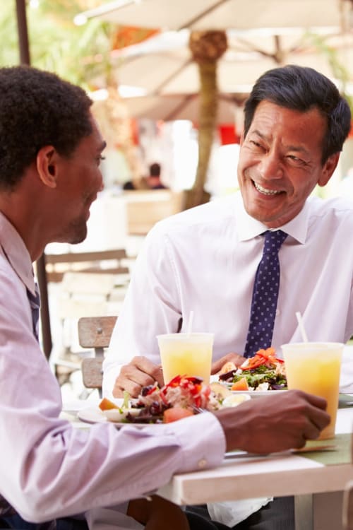 Friends enjoying a work lunch together near New Quin in Washington, District of Columbia