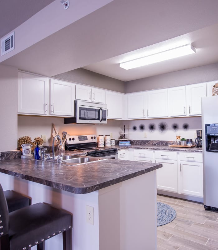 Kitchen with granite countertops at Scissortail Crossing Apartments in Broken Arrow, Oklahoma