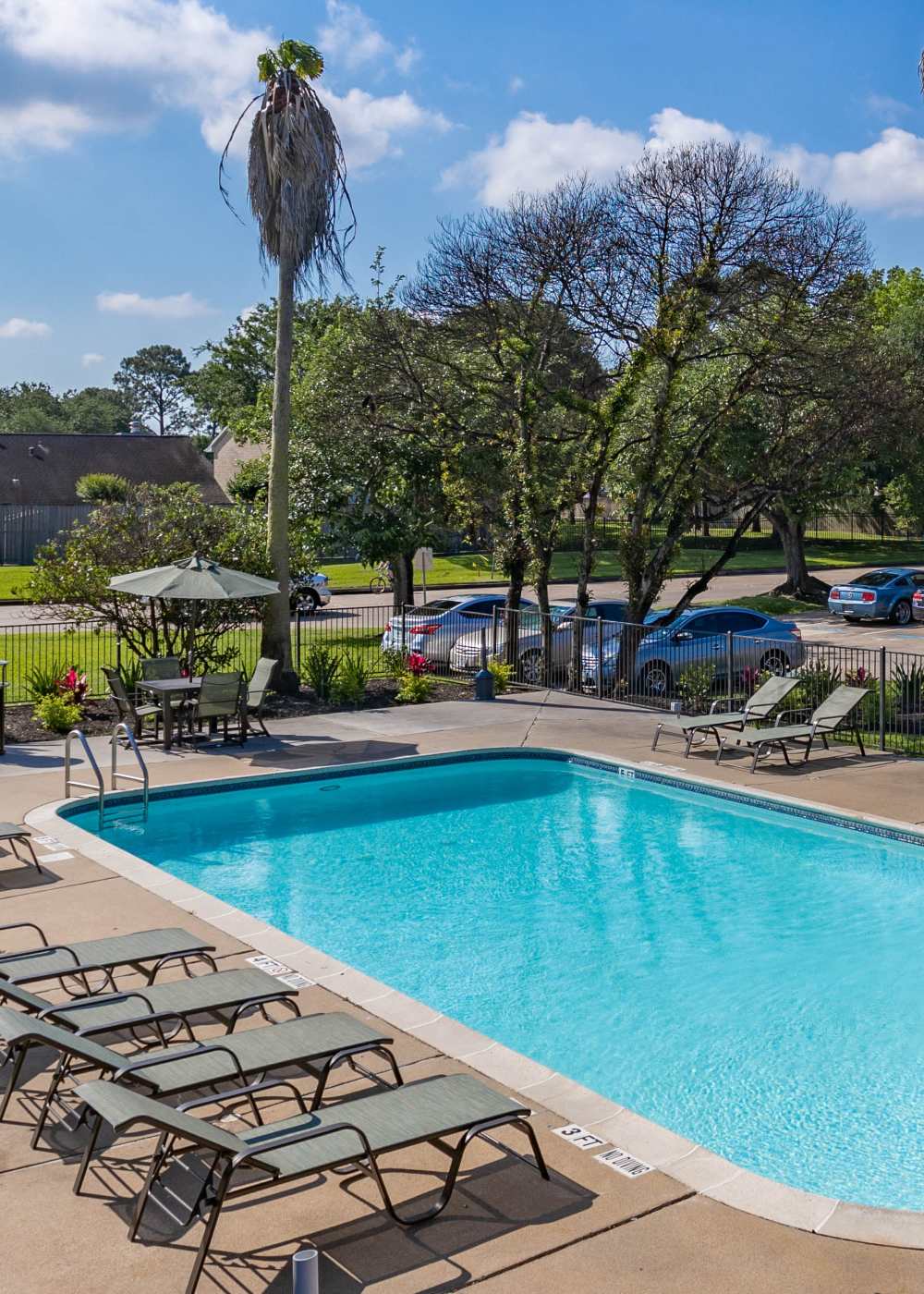 Swimming pool at University Green Apartments in Houston, Texas