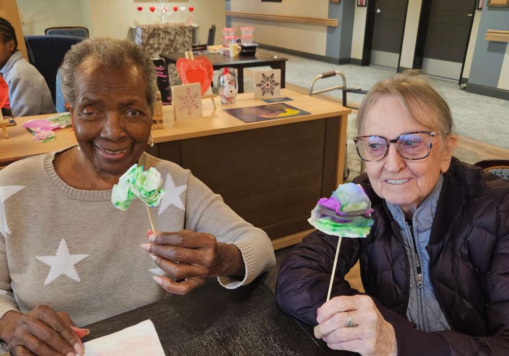 Residents holding their art creation at Merrill Gardens at Wright Park in Tacoma, Washington