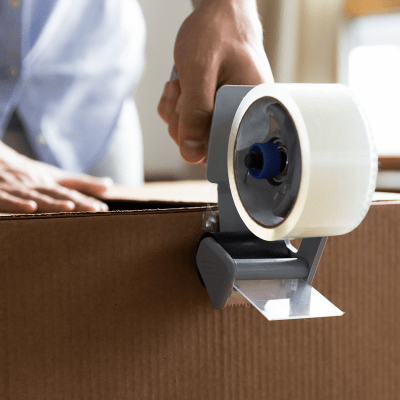 Sealing a box with packing tape at A-American Self Storage in Reno, Nevada