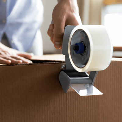 Sealing a box with packing tape at Sierra Vista Mini Storage in Bakersfield, California