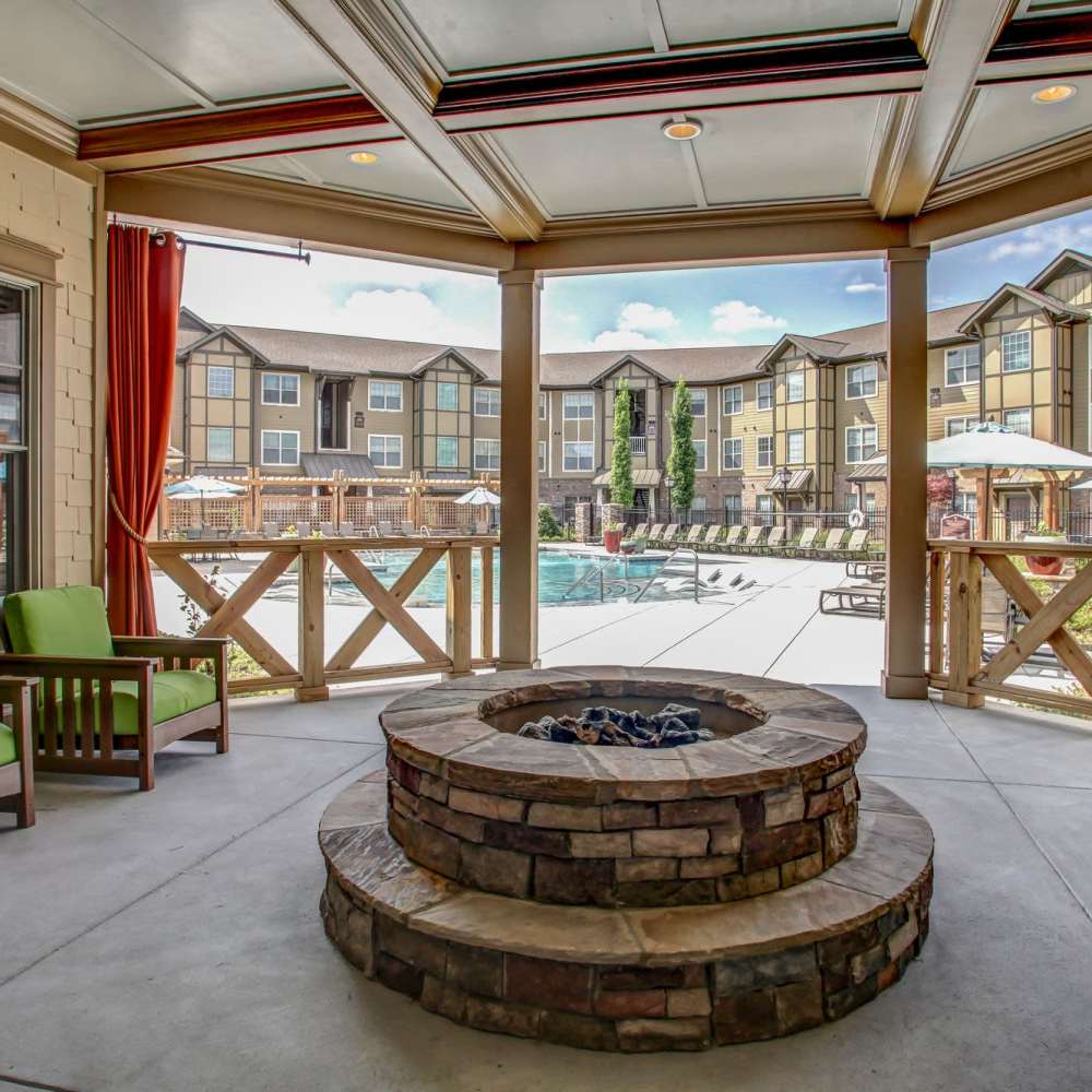 Charming outdoor lounge with a stunning view of a sparkling water pool at Avonlea Square in Smyrna, Georgia.