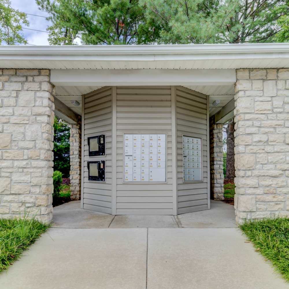 Charming entrance with inviting landscaping at Boulder Springs in Maryland Heights, Missouri.