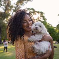 Resident with her pet dog at Pine Creek in Paris, Texas