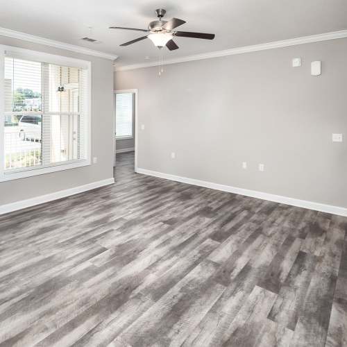 Unfurnished living room with large window at Mills Creek in Gastonia, North Carolina