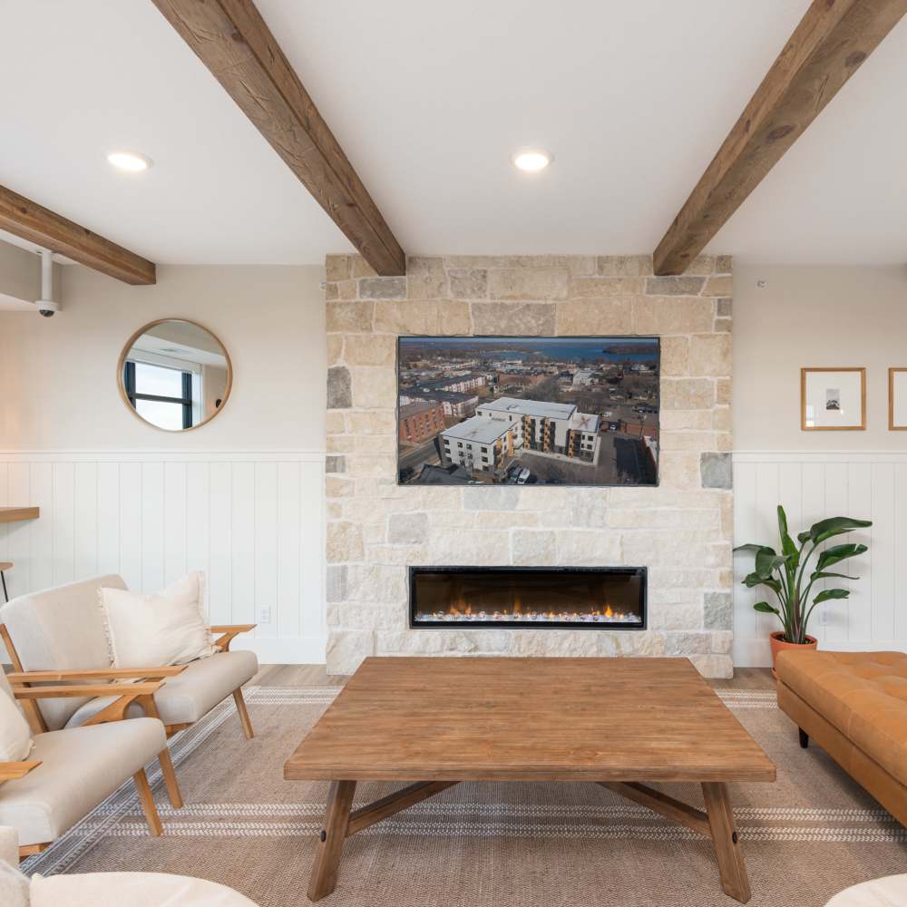 Living area with fireplace at The Uptown Apartments in Waconia, Minnesota