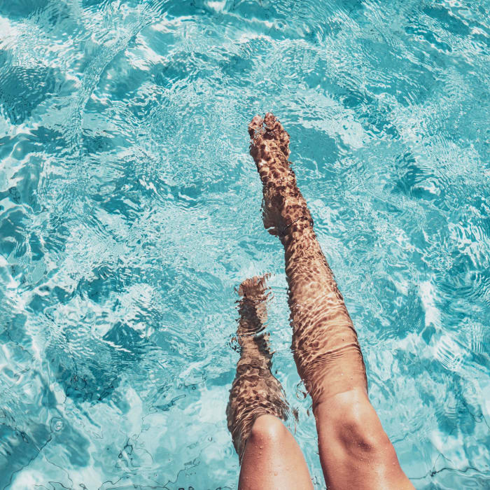 A resident cools off in the pool at CovePointe at The Landings, Norfolk, Virginia