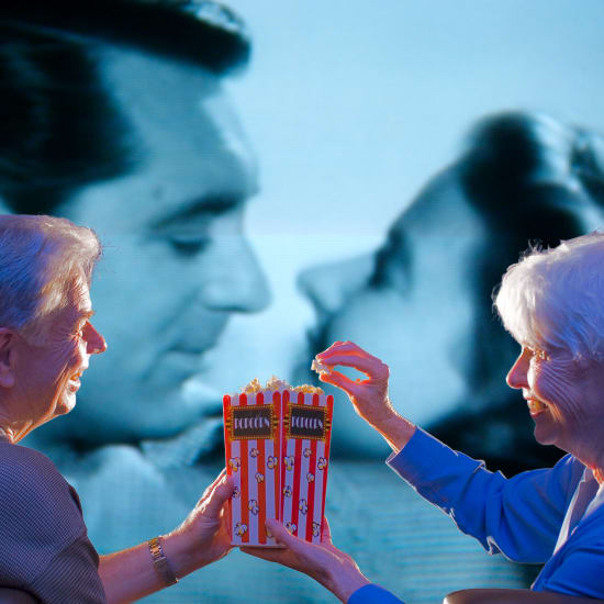 residents watching a movie at Carefield Living. 