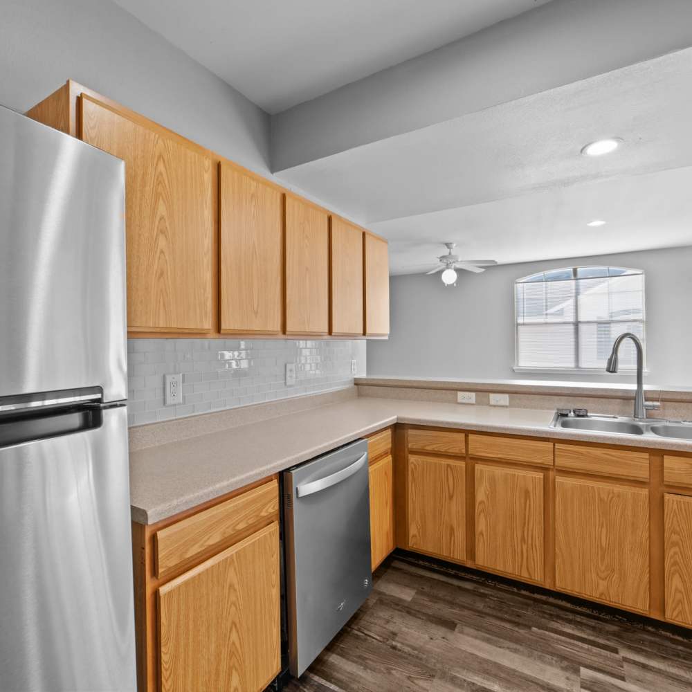 Kitchen with appliances at Burkburnett Residences in Burkburnett, Texas