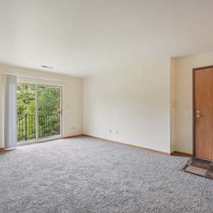 Unfurnished living room at Maple Leaf Apartments in Merrillville, Indiana