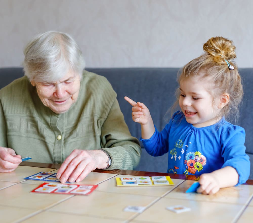 A resident and child playing at Amaran Senior Living in Albuquerque, New Mexico.