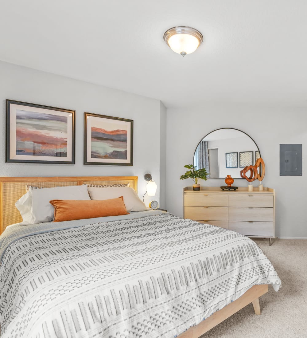 Plush carpeting and retro-modern furnishings in a model home's bedroom at Terra at Hazel Dell in Vancouver, Washington