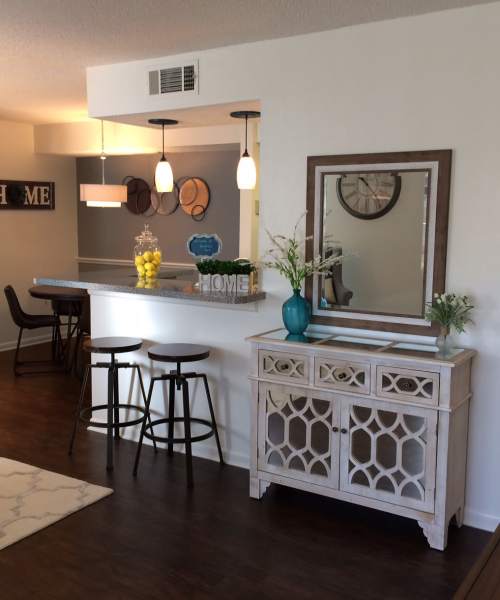 Living room with access to dining at Hunters Run in Gainesville, Florida