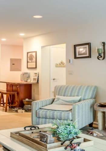 Well lit seating area with armchair at Brinley Manor in Bradley Beach, New Jersey