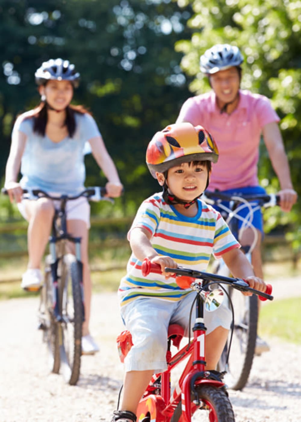 Resident family riding bikes at Decker Apartment Homes in Ft Worth, Texas that has bicycle storage