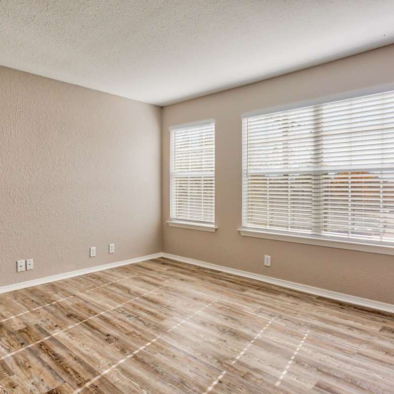 Bright living room with window at The Gardens At Duncan Apartments in Duncan, Oklahoma