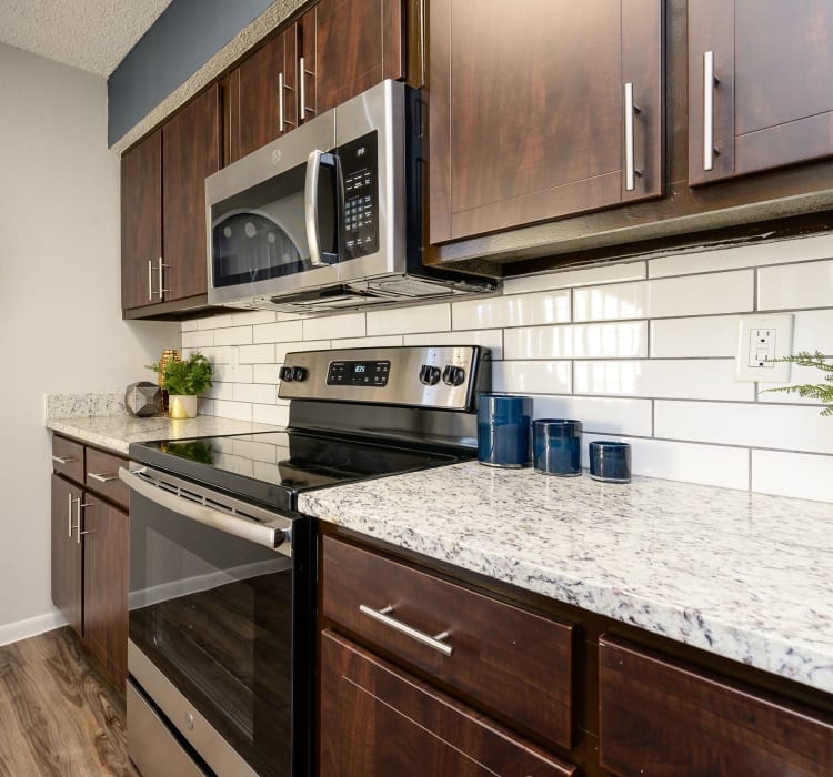 Kitchen with wood cabinetry at Laurel Heights at Cityview in Fort Worth, Texas