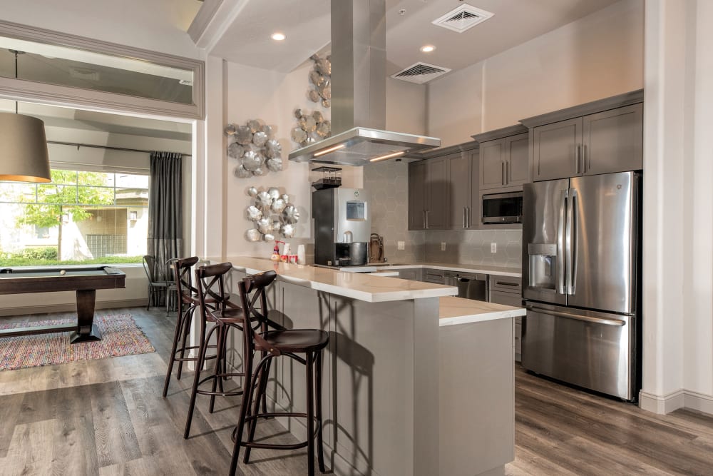 Resident clubhouse with a large community kitchen at The Artisan Apartment Homes in Sacramento, California