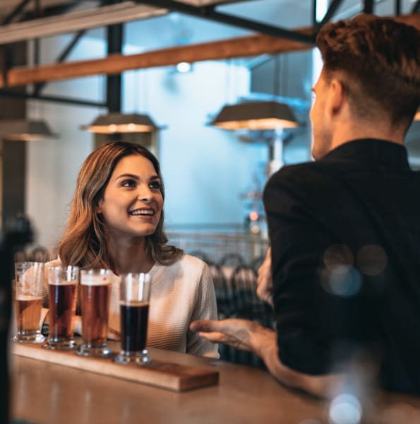 Friends enjoying a drink at a bar near Integra Lakes in Casselberry, Florida
