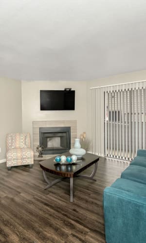 Spacious living room with fireplace at Pecan Ridge in Waco, Texas