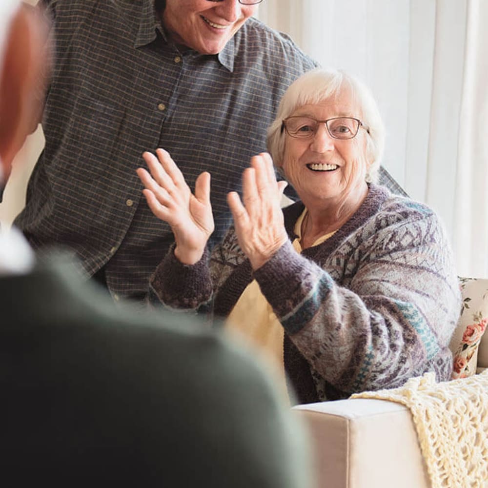 Resident laughing and clapping at Anthology of Louisville in Louisville, Kentucky