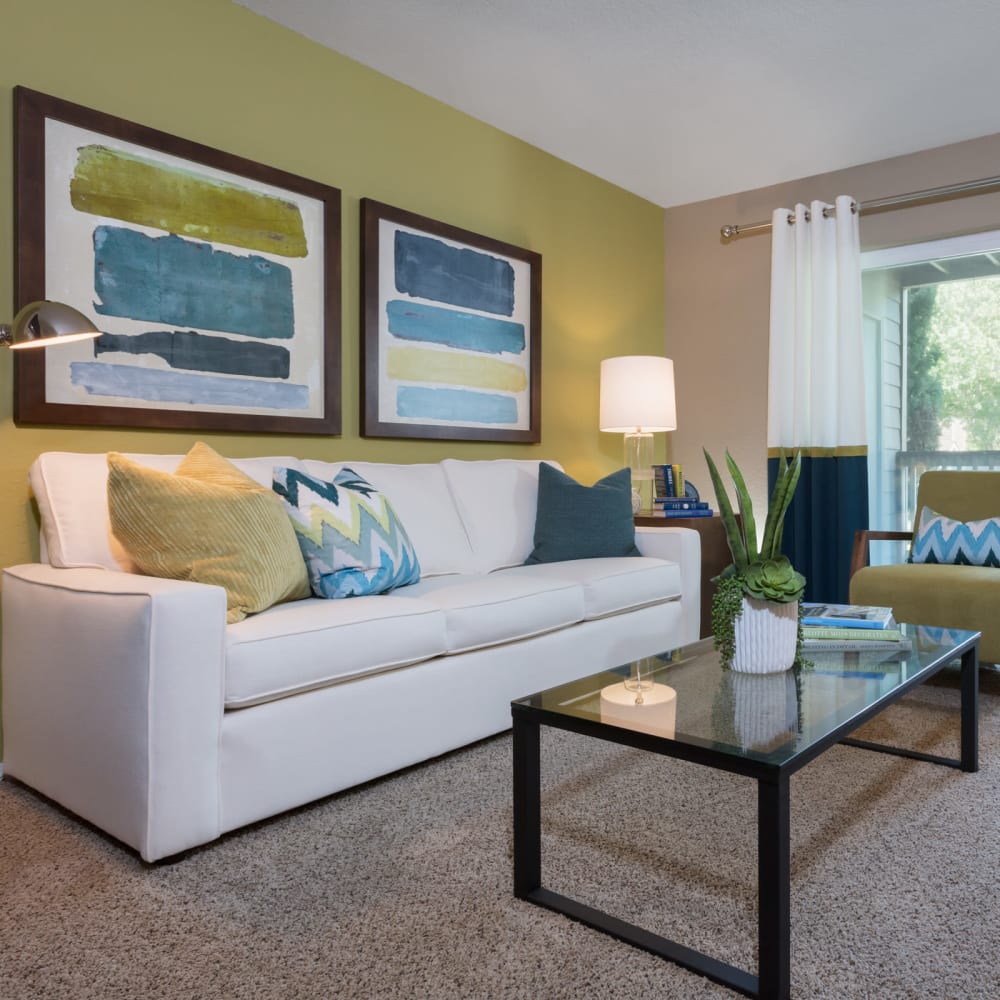 Spacious and modern open-concept floor plan with plush carpeting in a model home at Timbers at Tualatin in Tualatin, Oregon