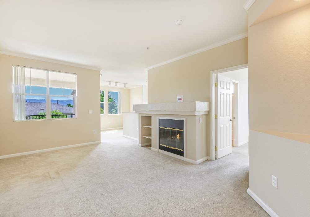 Unfurnished living room with windows at Park Hacienda Apartments in Pleasanton, California