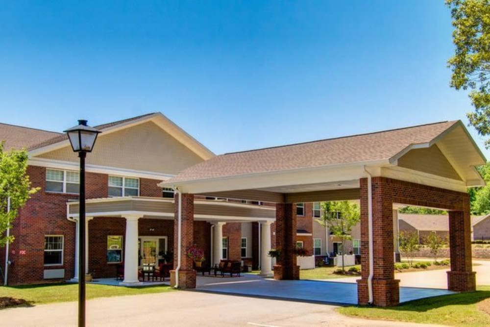 Spacious portica shea and brick exterior at Carolina Gardens at Conway in Conway, South Carolina
